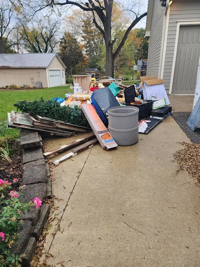 Dumpster being loaded with debris for 3 Yard Dumpster Rental in Bealeton